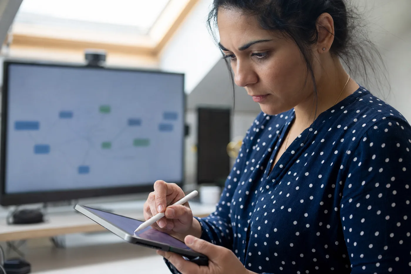An employee answering an AI tutor's question on a tablet with a stylus during interactive training